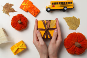 Fall season concept with school bus and fall accessories